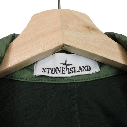 Stone Island green nylon overshirt jacket with full zip and compass logo patch.