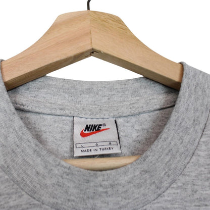 Nike grey short sleeve cotton t-shirt with pocket and vintage logo detail.