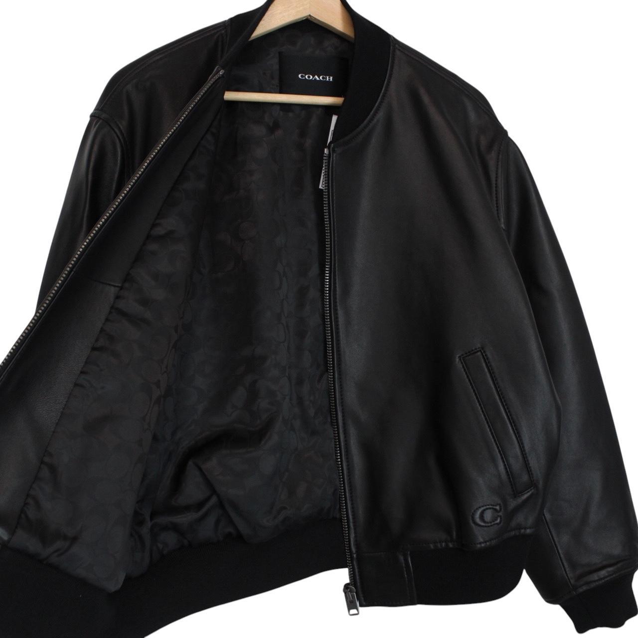 Coach black lamb leather bomber jacket with full zip and brand logo.