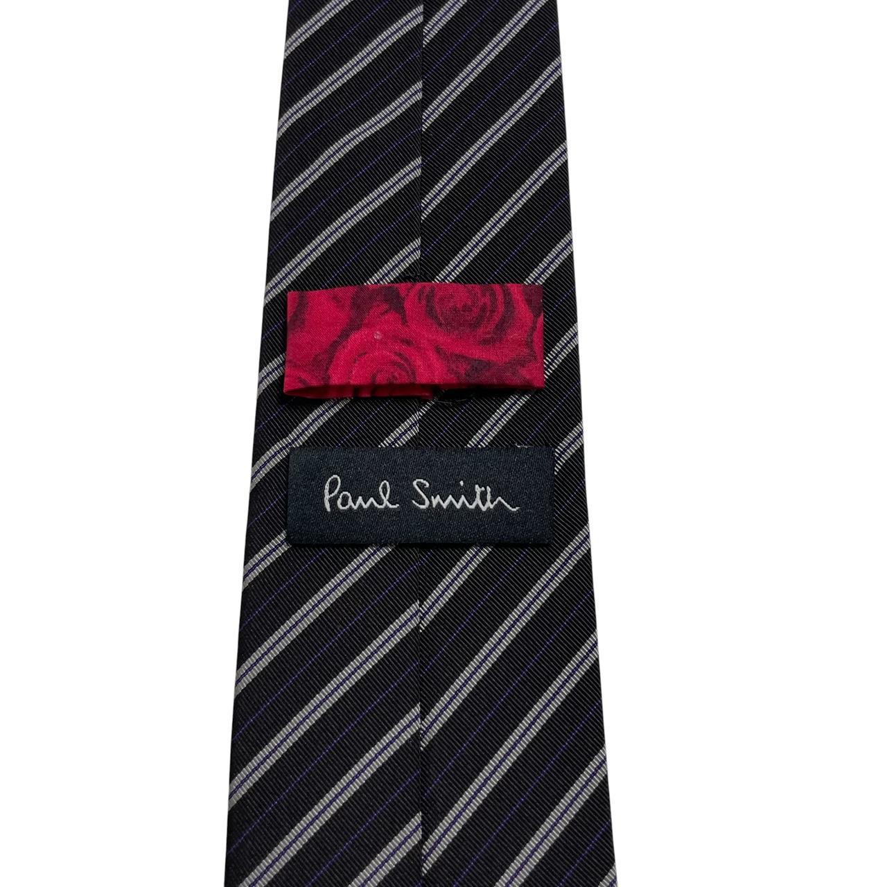Paul Smith black and grey striped silk blend tie with subtle logo detail.
