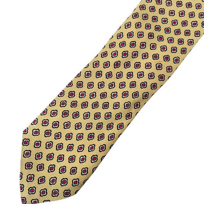 Polo Ralph Lauren yellow silk tie with geometric print design and logo detail.