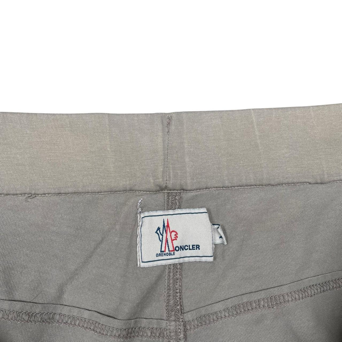 Moncler grey jogger shorts cotton material with logo detail and minor marks.