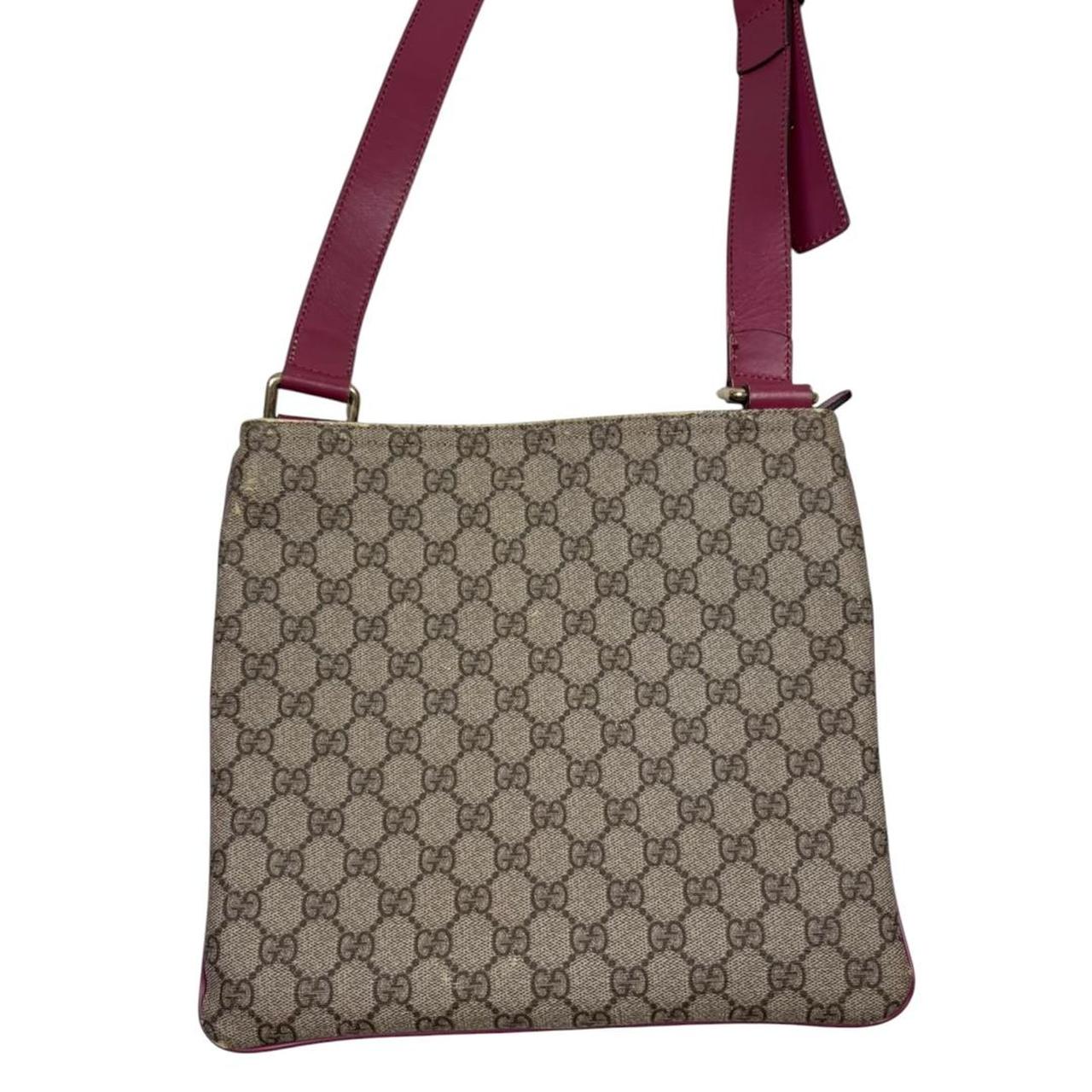 Gucci beige and pink duffel bag with GG Supreme monogram canvas pattern.
