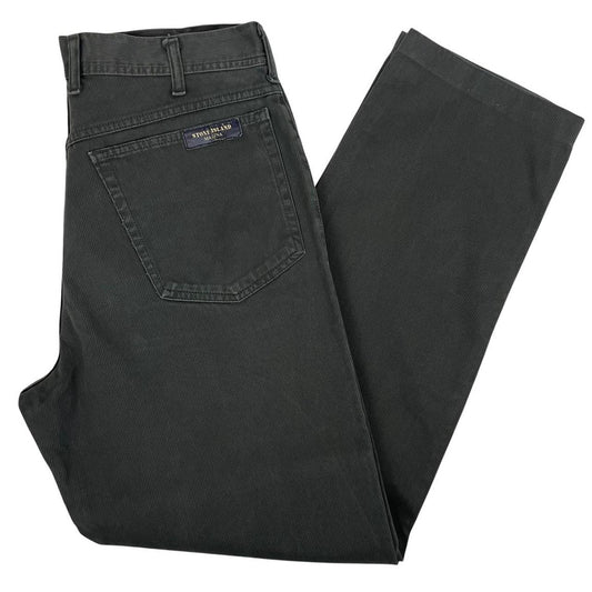 Stone Island green corduroy trousers with branded back pocket tab and regular fit.
