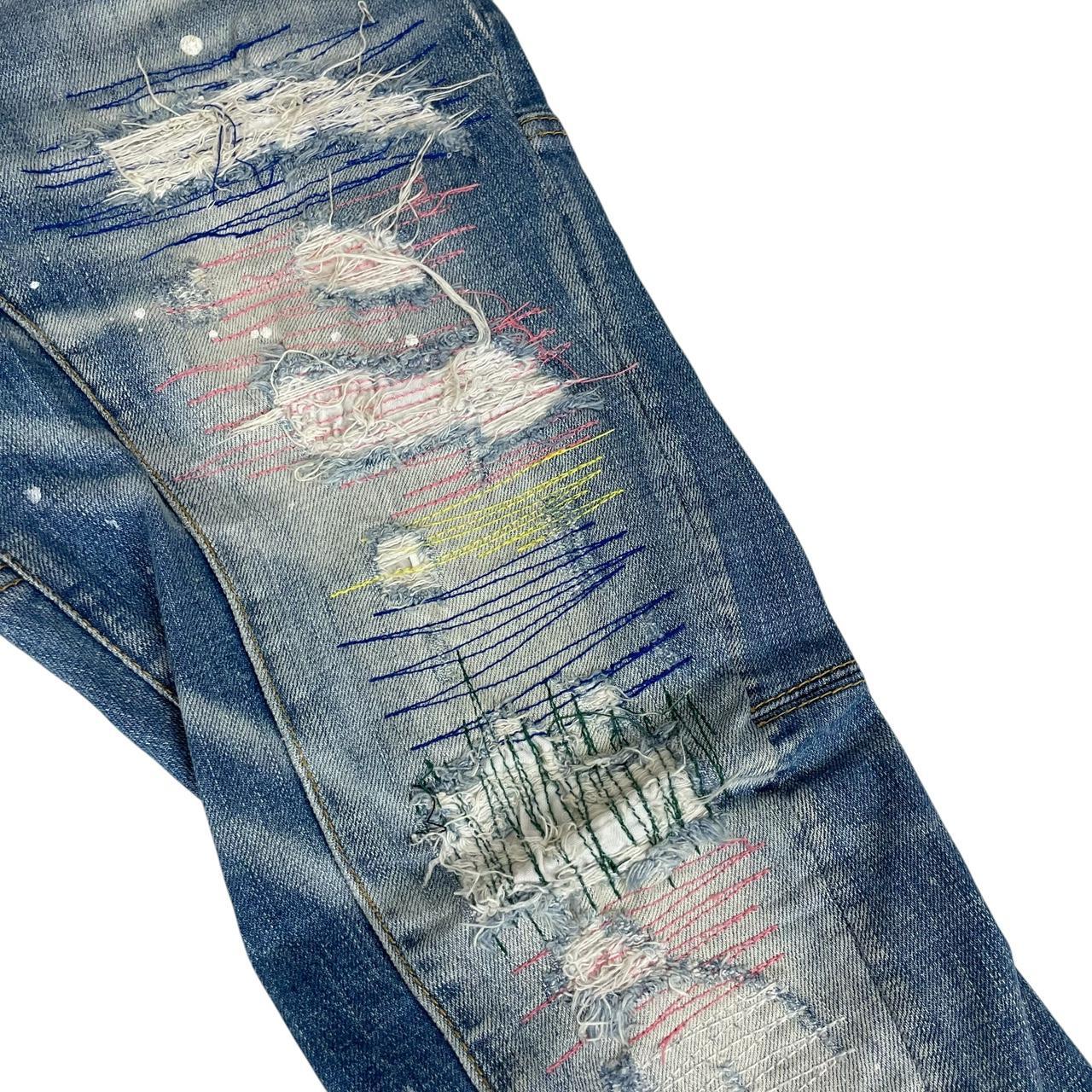 Dsquared2 blue straight jeans with distressed details and logo patch on back pocket.