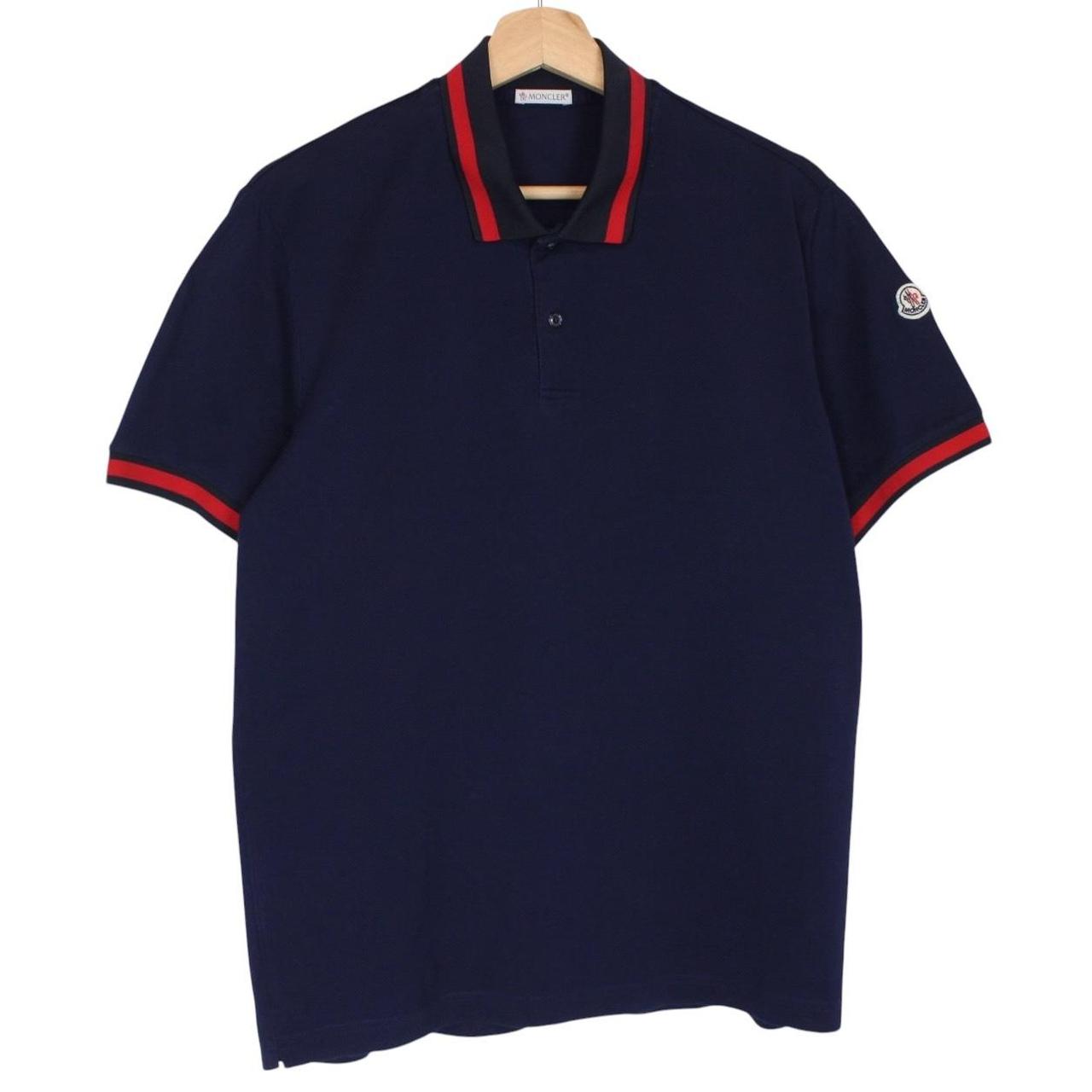 Moncler navy blue short sleeve polo shirt with embroidered logo and cotton material.