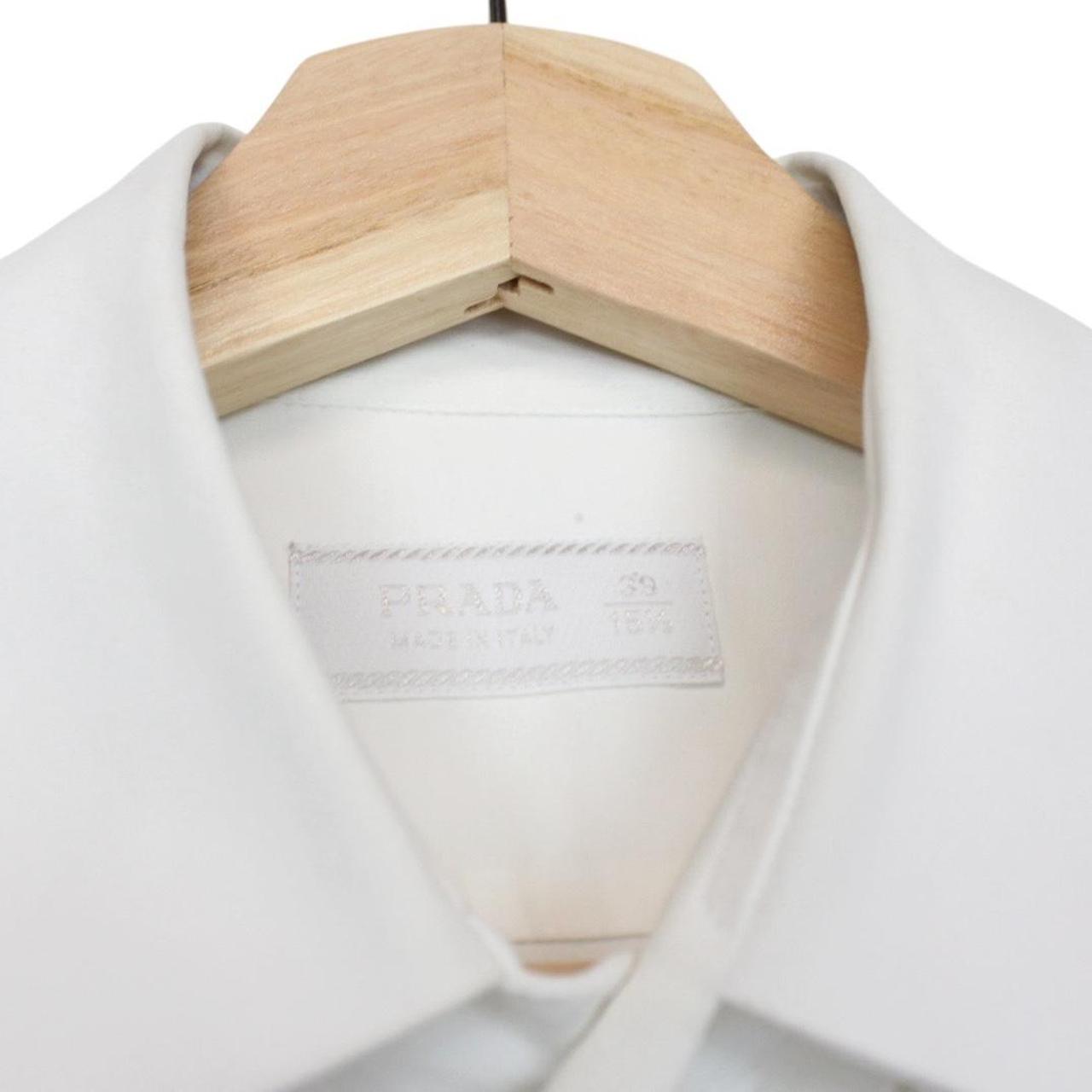 Prada white long sleeve shirt with popeline stretch fabric and cut care labels.