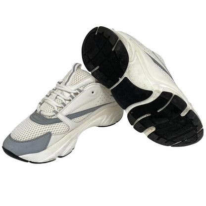 Dior grey and white trainers with logo detailing and worn soles.