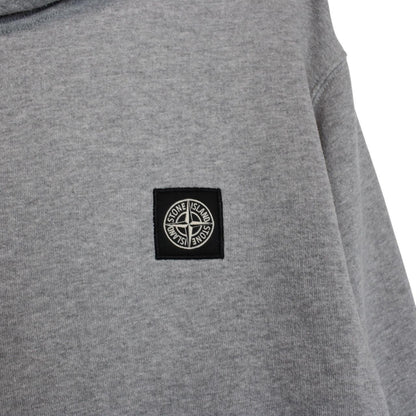 Stone Island grey cotton hoodie with iconic compass logo and drawstring hood.