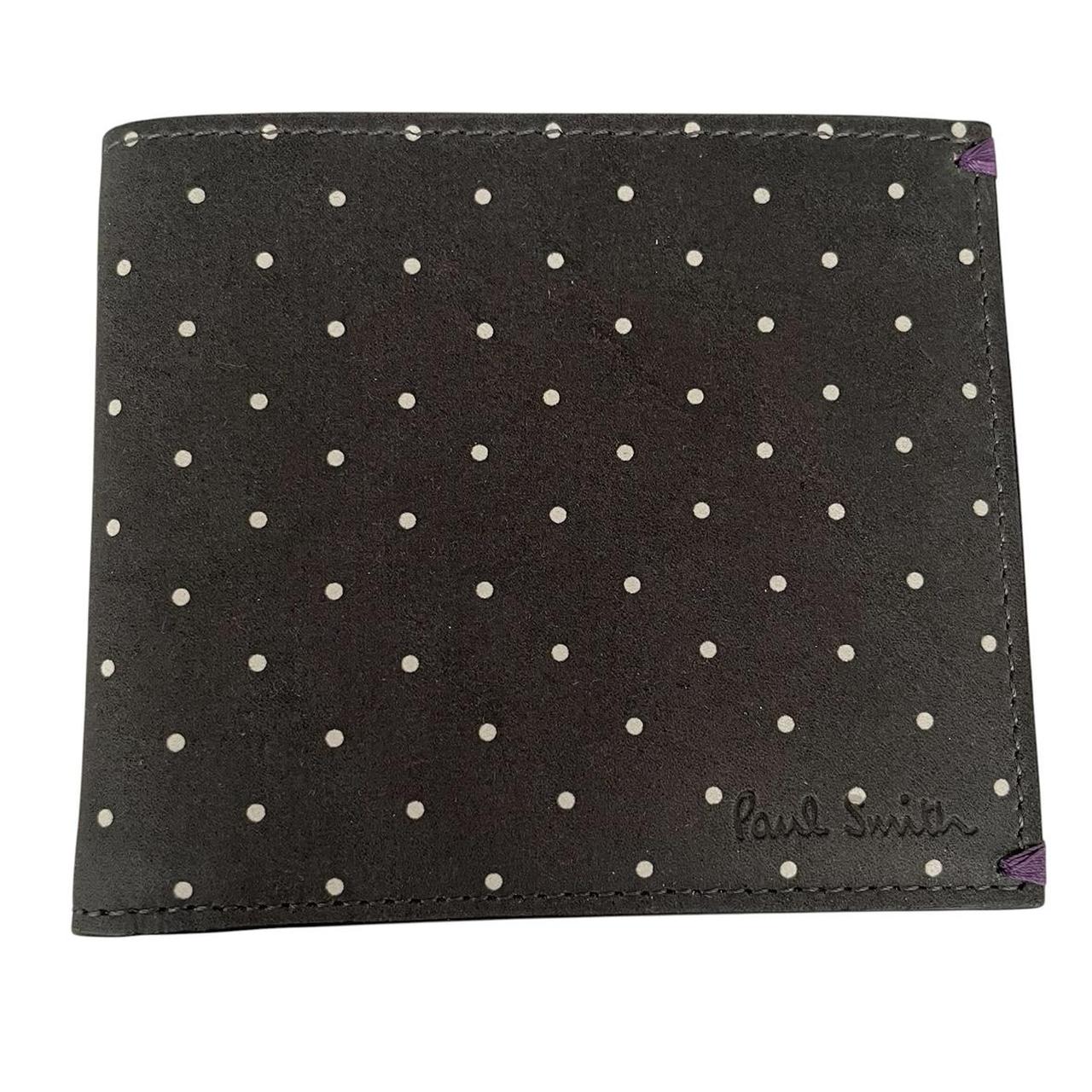 Paul Smith grey leather bifold wallet with polka dot pattern and embossed logo.