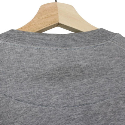 Stone Island grey cotton sweatshirt with logo patch and soft texture.