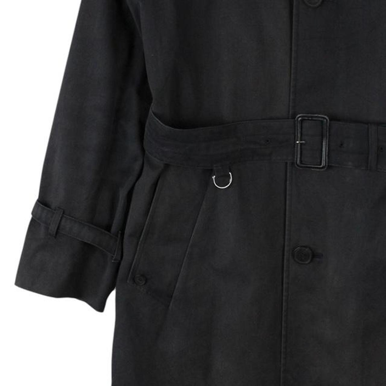 Aquascutum black trench coat with house check pattern and belted waist detail.