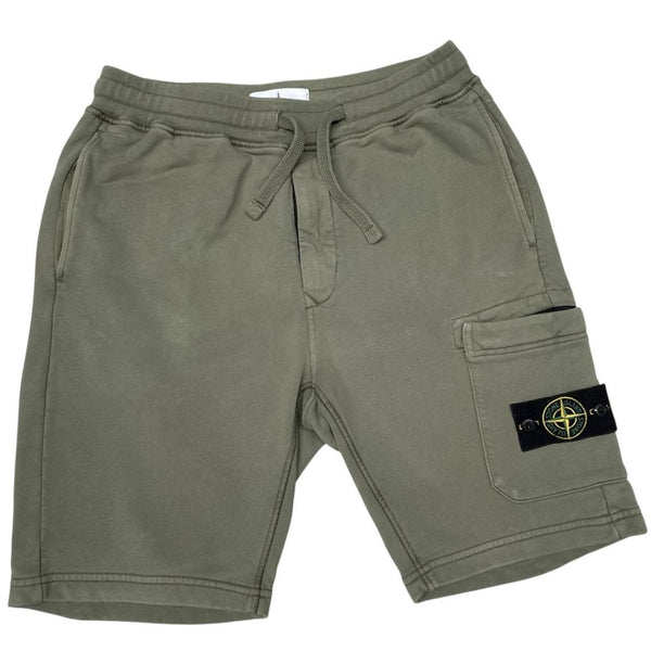 Stone Island green jogger shorts with logo patch and cotton material.