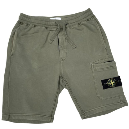 Stone Island green jogger shorts with logo patch and cotton material.