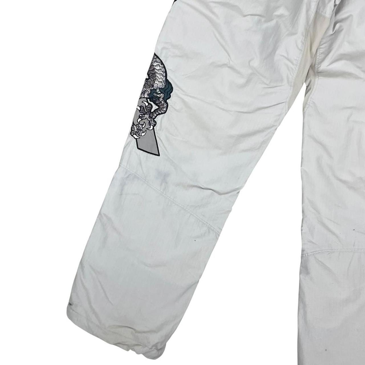 Palace grey joggers embroidered dragon design, made of nylon, size medium.