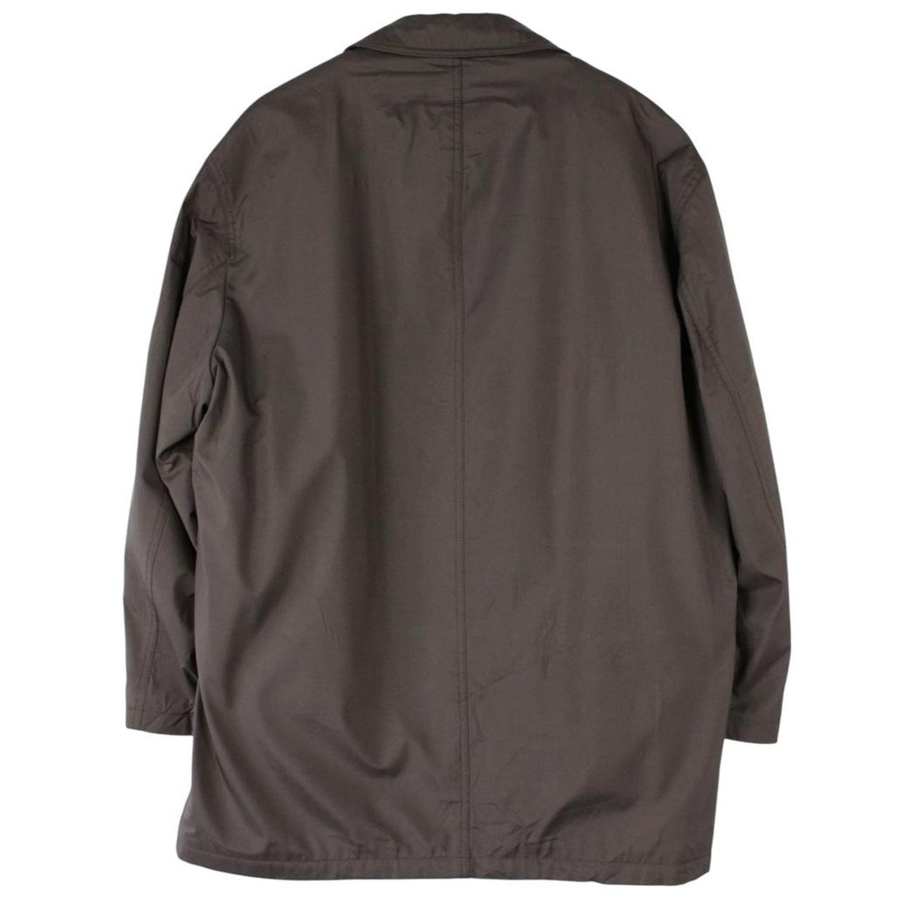 Burberry brown quilted coat featuring iconic Nova Check pattern and removable wool lining.