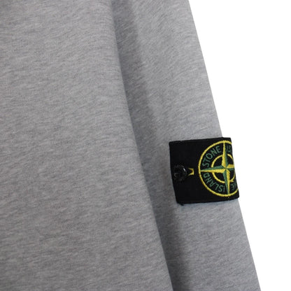 Stone Island grey cotton hoodie with iconic compass logo and drawstring hood.