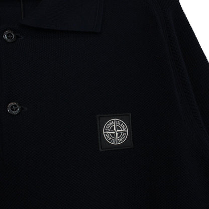 Stone Island navy blue polo shirt with Compass patch and three-button placket.