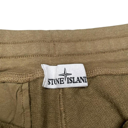 Stone Island khaki brown jogger shorts with logo patch and cotton material.