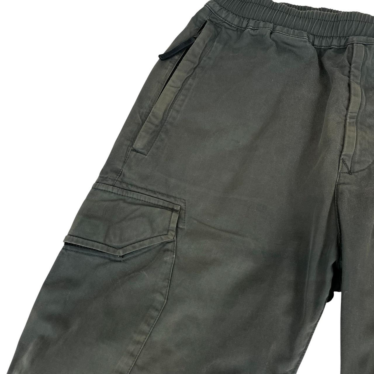 Stone Island grey cargo trousers with logo patch and pockets, visible discolouration.