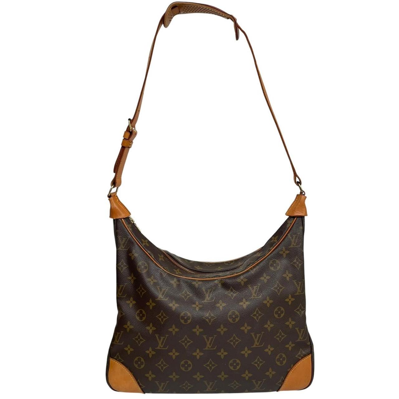 Louis Vuitton brown and tan monogram canvas duffel bag with leather accents and logo.