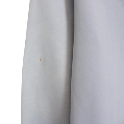 Stone Island blue cotton sweatshirt with logo patch and faded left sleeve.