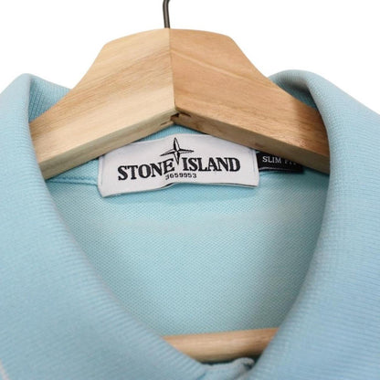 Stone Island blue polo shirt with embroidered compass logo and slim fit cotton material.