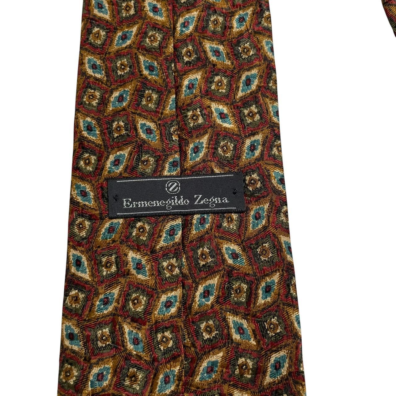 Ermenegildo Zegna multicoloured silk tie with intricate patterns and luxurious sheen.