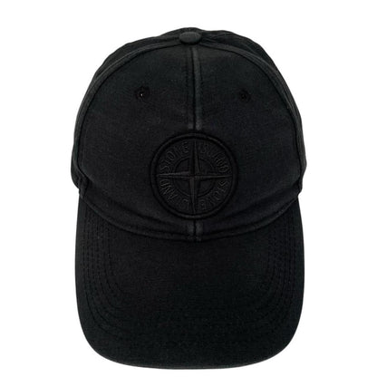 Stone Island black baseball cap with embroidered compass logo and cotton material.
