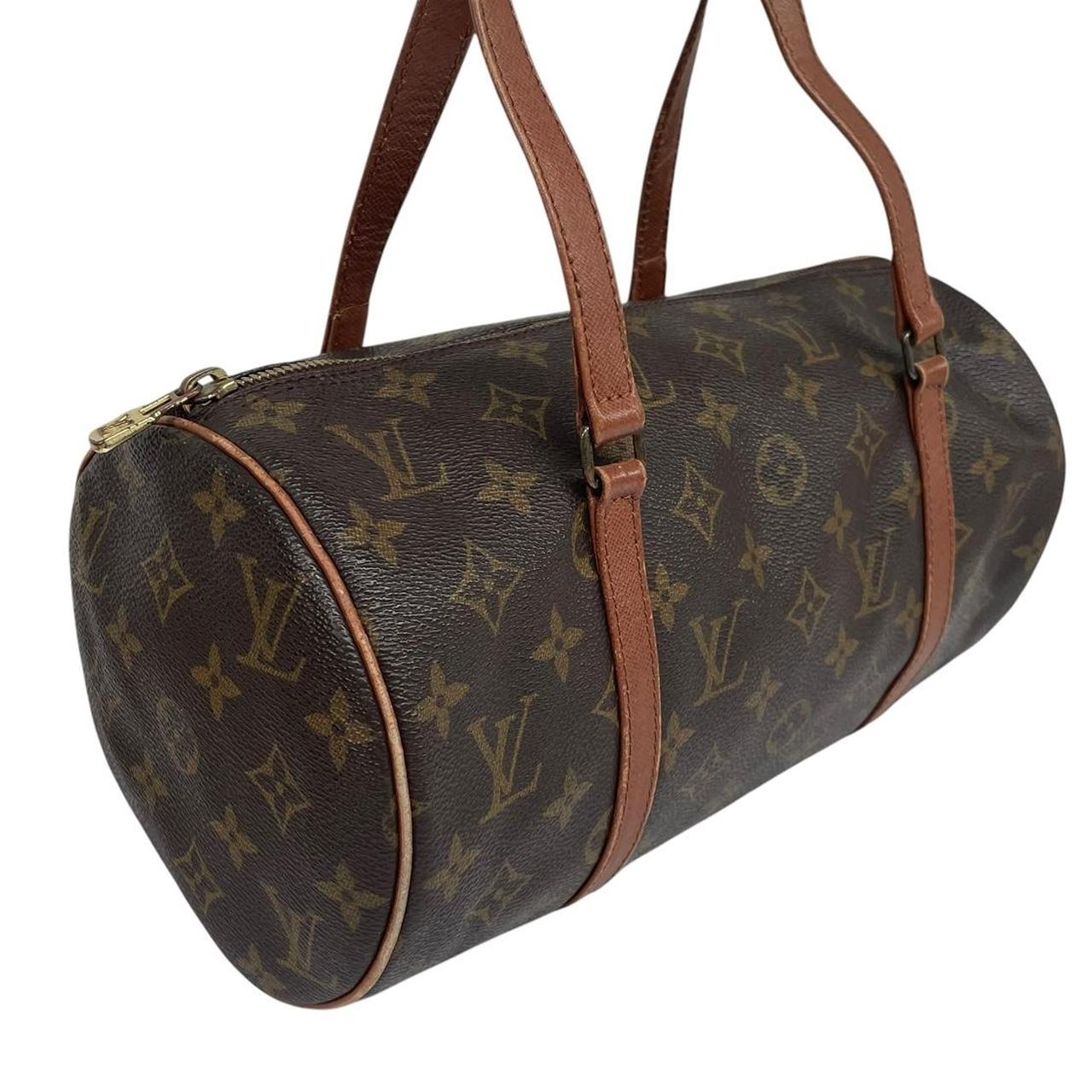 Louis Vuitton duffel bag brown and tan monogram canvas with logo pattern and wear.