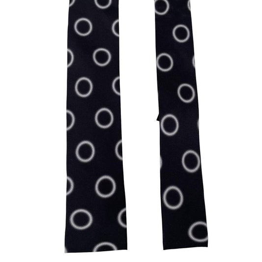Paul Smith black and white silk tie with circular print and square cut design.