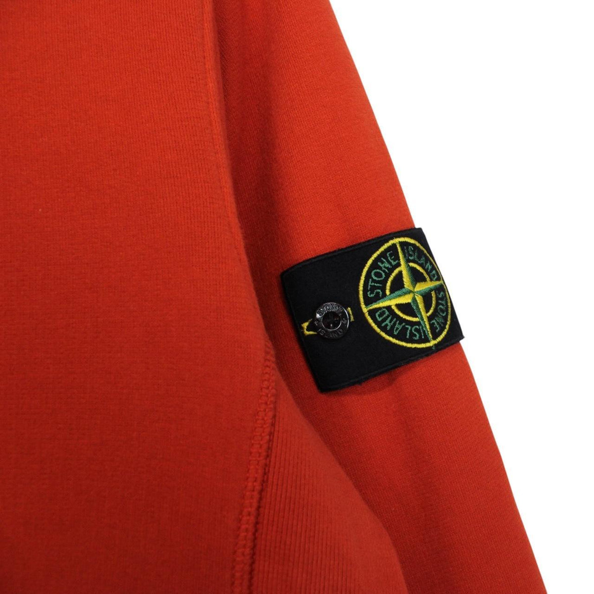 Stone Island red cotton sweatshirt with embroidered logo and ribbed cuffs.
