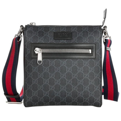 Gucci black duffel bag featuring GG Supreme monogram pattern and adjustable strap.