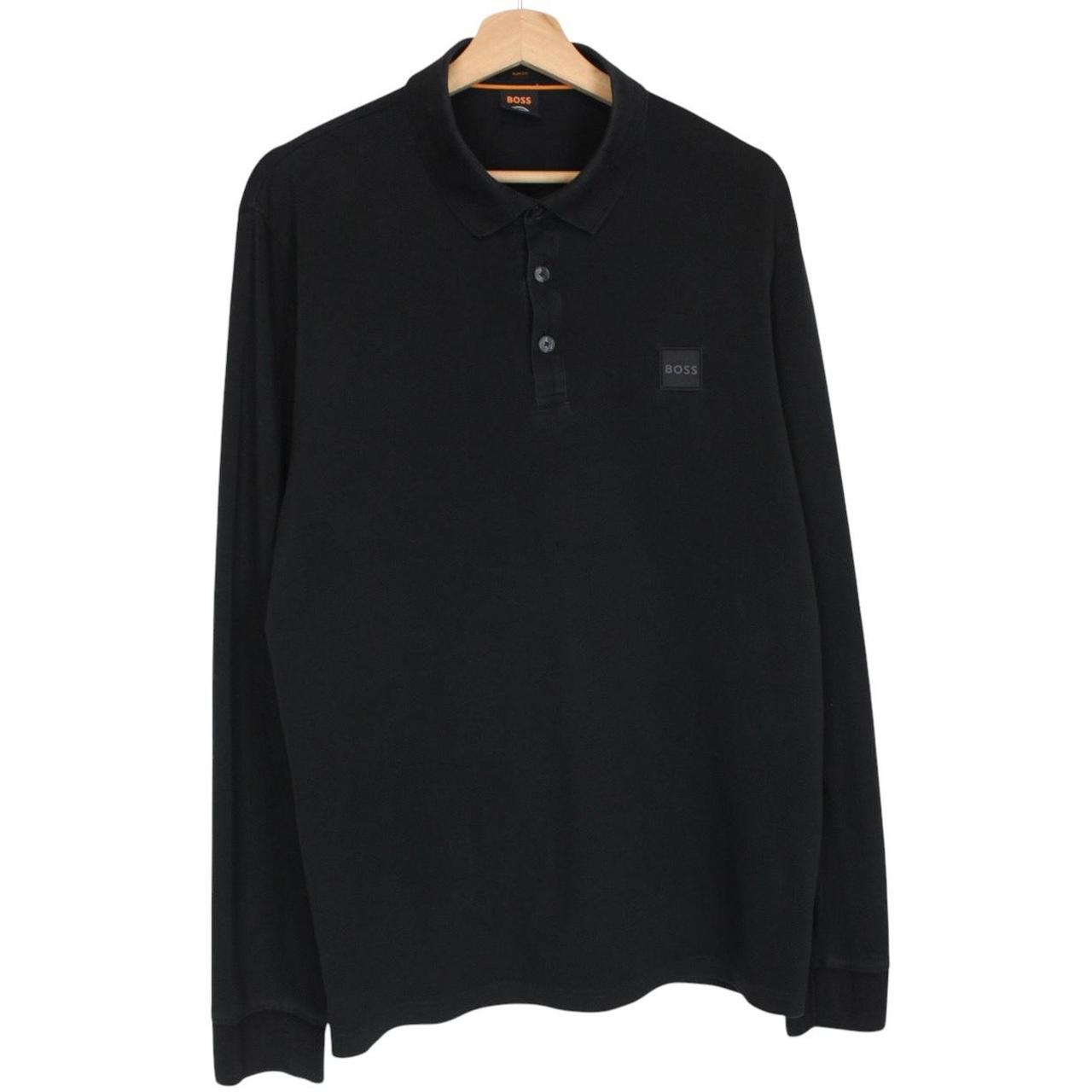 Hugo Boss black long sleeve polo shirt, slim fit, cotton material, subtle wear marks.