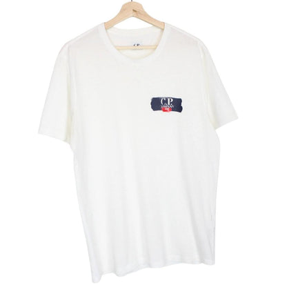 CP Company white short sleeve cotton t-shirt with chest logo print and pocket detail.