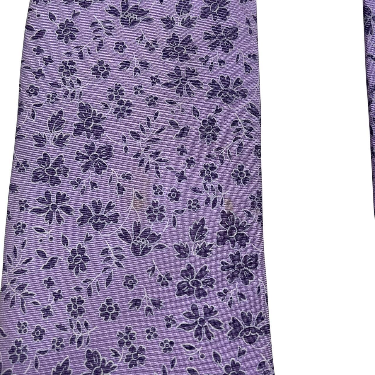 Ermenegildo Zegna purple silk tie with floral pattern and logo detail.