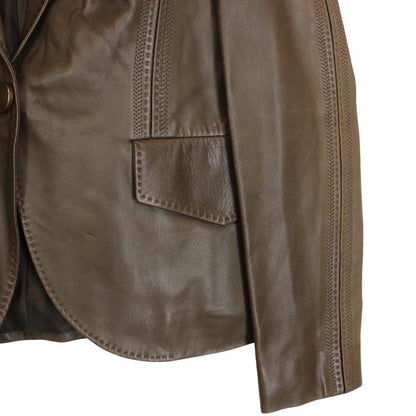 Gucci brown leather blazer jacket with logo detailing and classic tailored fit.