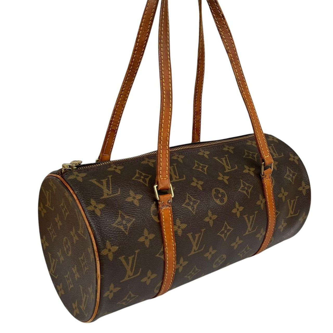 Louis Vuitton duffel bag brown and tan monogram canvas with logo and piping details.