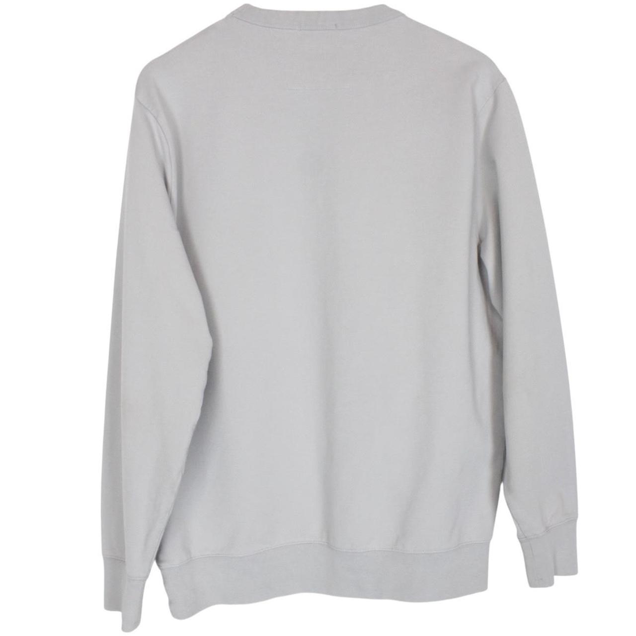 CP Company grey cotton sweatshirt with logo patch and ribbed cuffs.