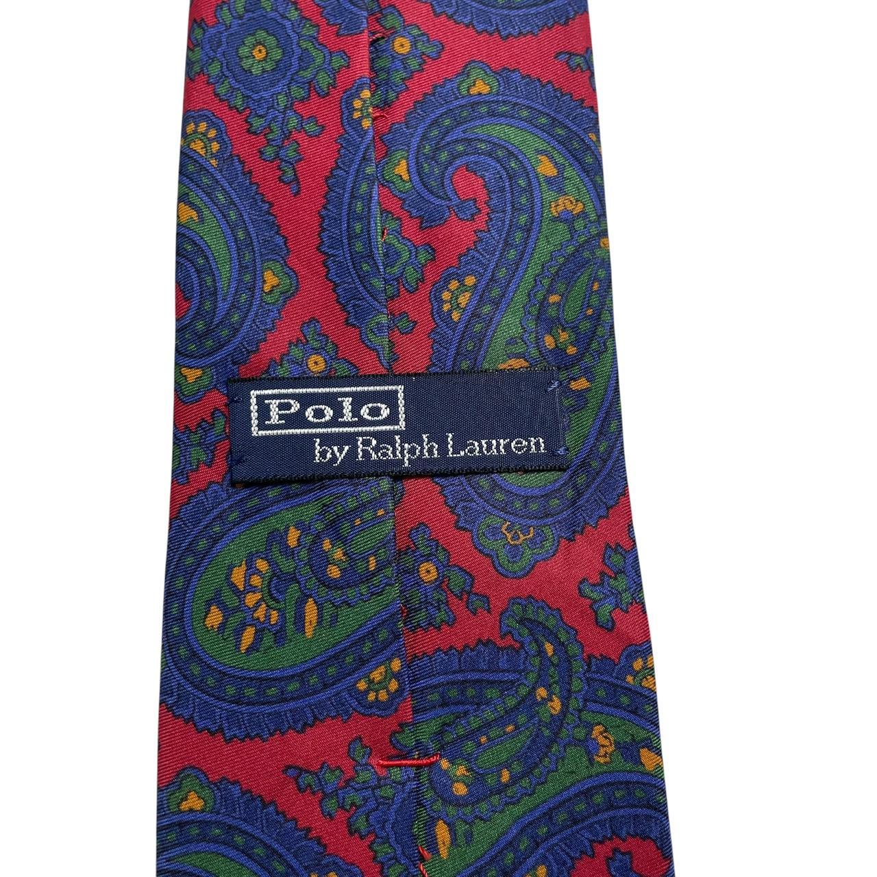 Polo Ralph Lauren multicoloured paisley print silk tie with vibrant patterns and luxurious texture.