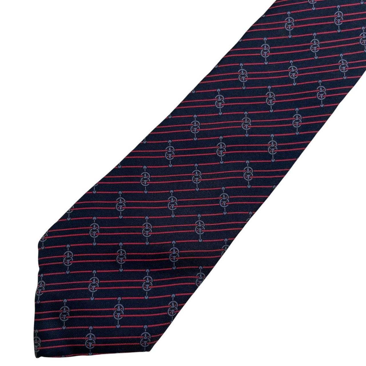 Yves Saint Laurent navy blue and red striped silk tie with logo detail.