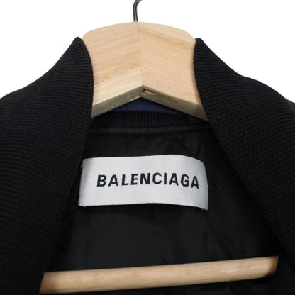 Balenciaga navy bomber jacket with full zip and campaign logo on chest.