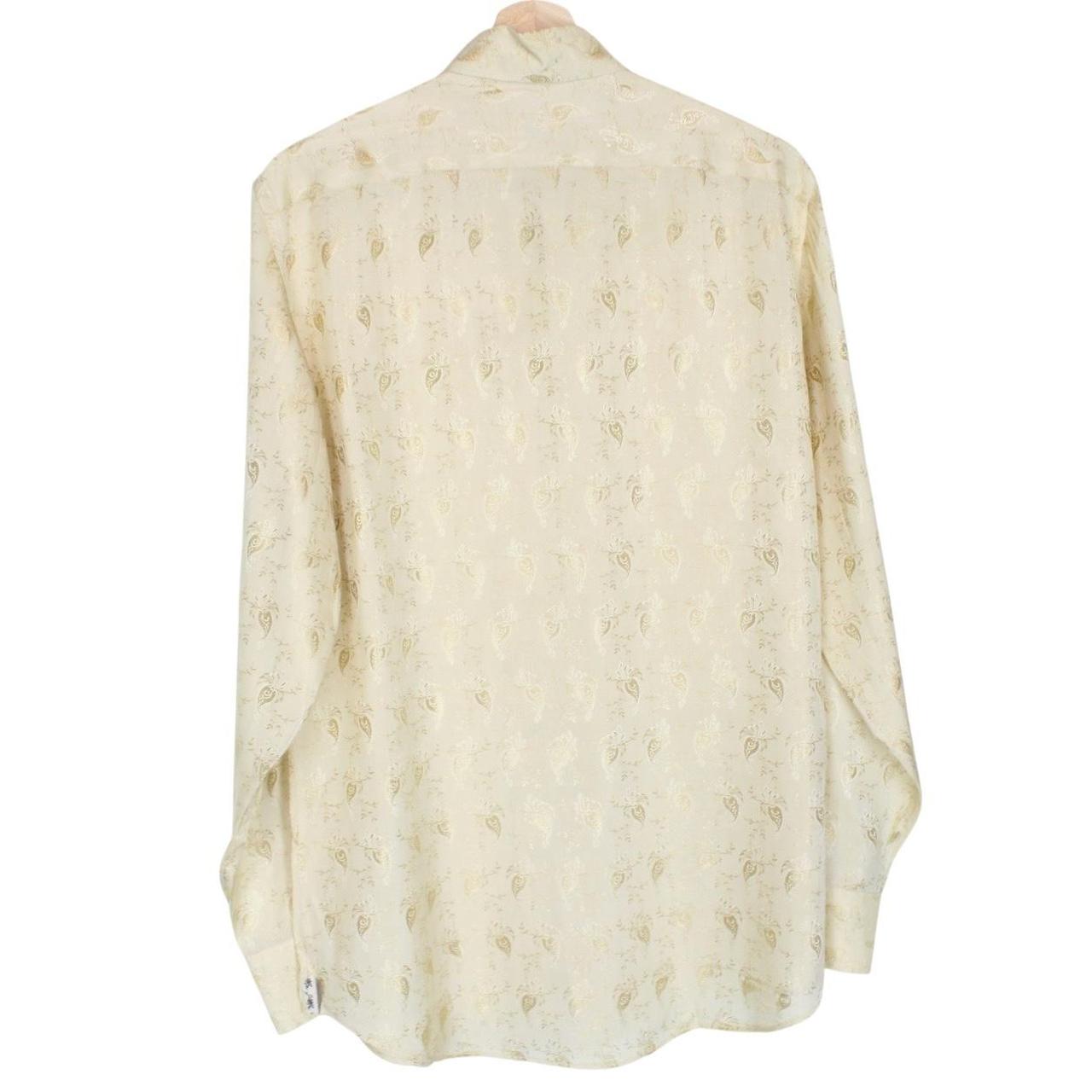 Paul Smith beige long sleeve silk shirt with subtle logo detail and smooth texture.