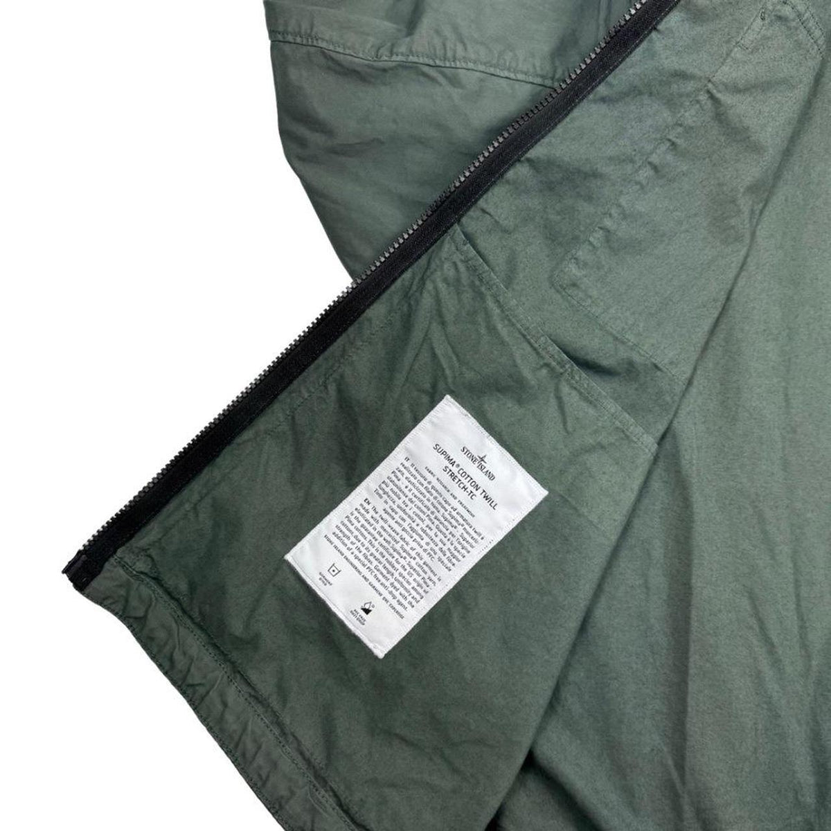 Stone Island green hooded jacket with full zip, Supima cotton twill material, logo patch.