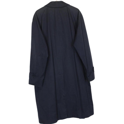 Burberry navy blue trench coat featuring classic Nova Check pattern and single-breasted design.