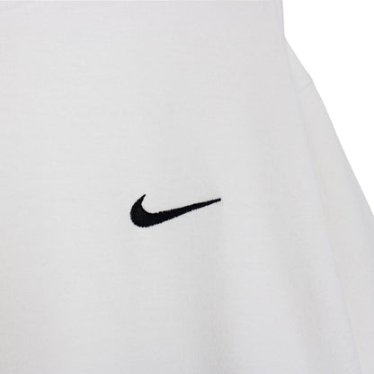 Nike white short sleeve cotton t-shirt with pocket and vintage logo detail.