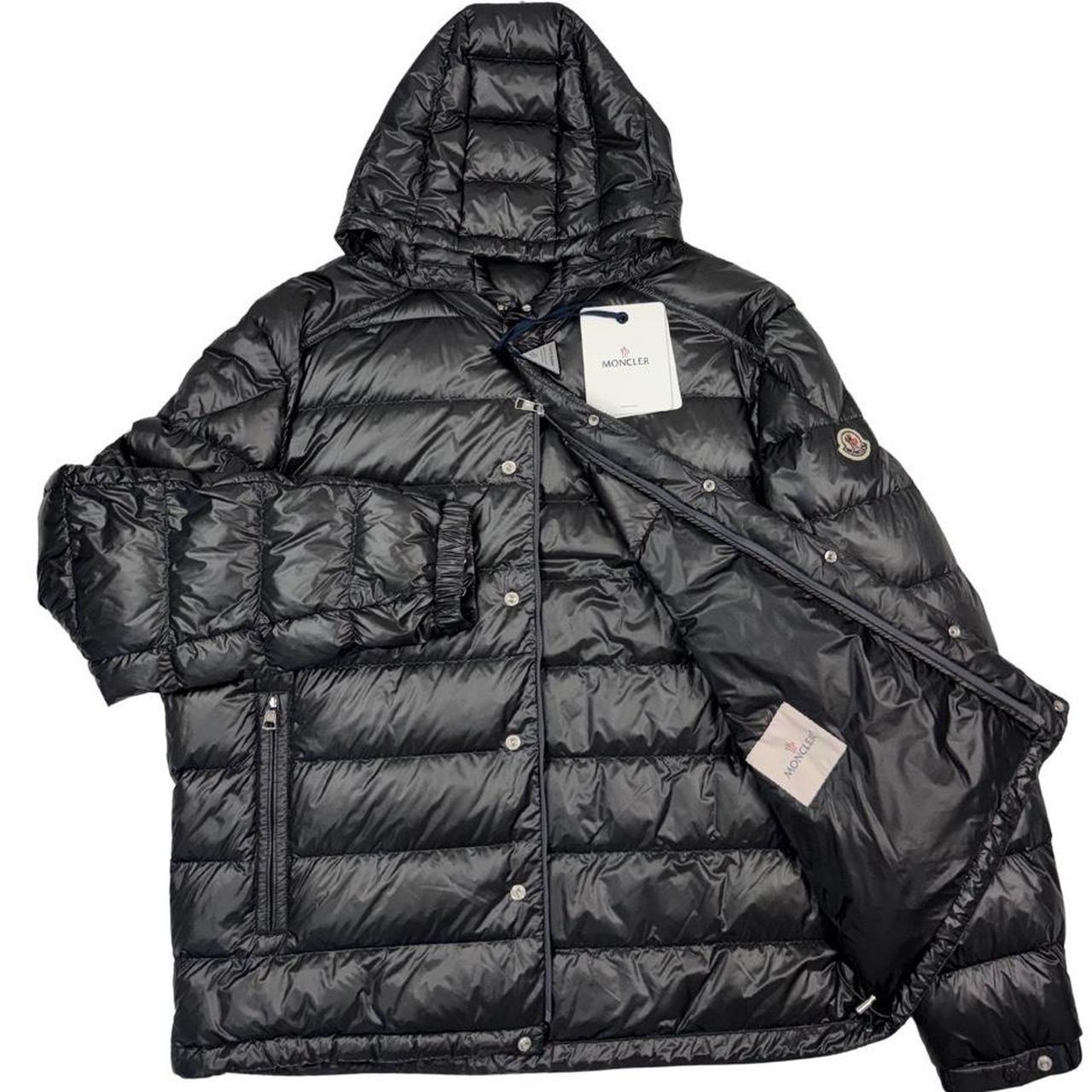 Moncler grey down nylon hooded puffer jacket with logo patch and quilted design.