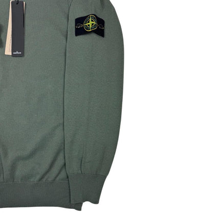 Stone Island green knit jumper made from organic cotton with logo patch detail.