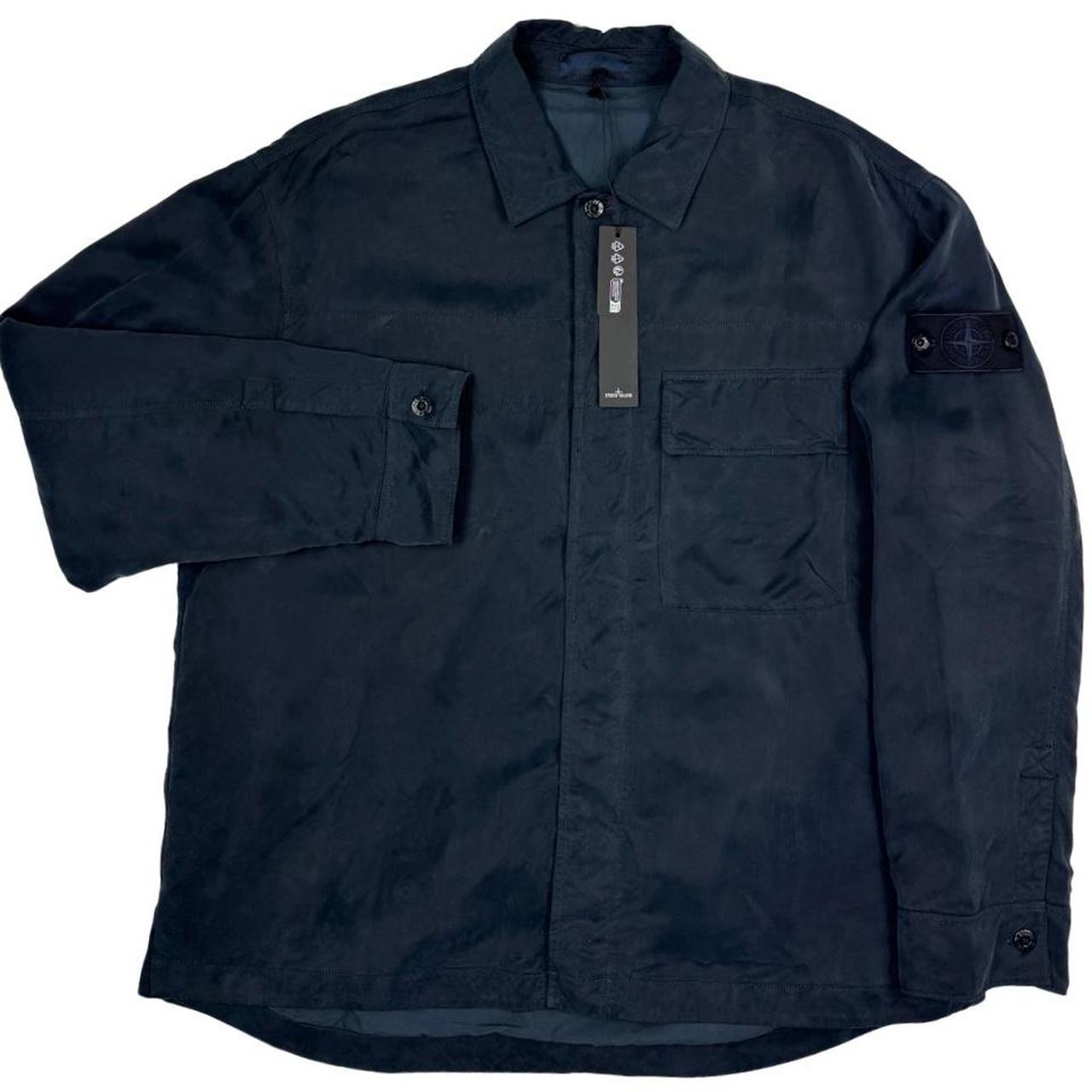 Stone Island navy blue overshirt jacket with flap pocket and monochrome logo patch.