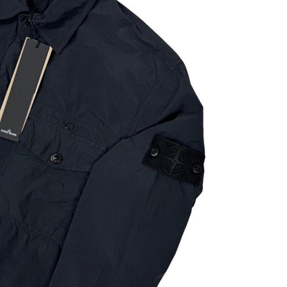 Stone Island black nylon overshirt jacket with ghost logo and smooth texture.